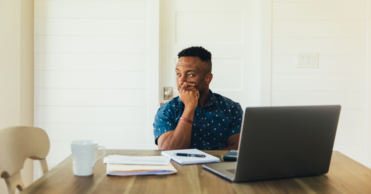 Thoughtful man with laptop