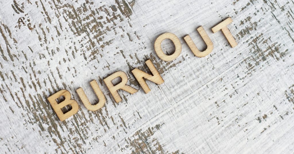Emotional Burnout: Why It Builds Gradually (and What Actually Helps) 1 Burnout text on wooden letters