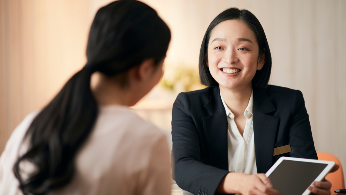 Smiling professional speaking with a client