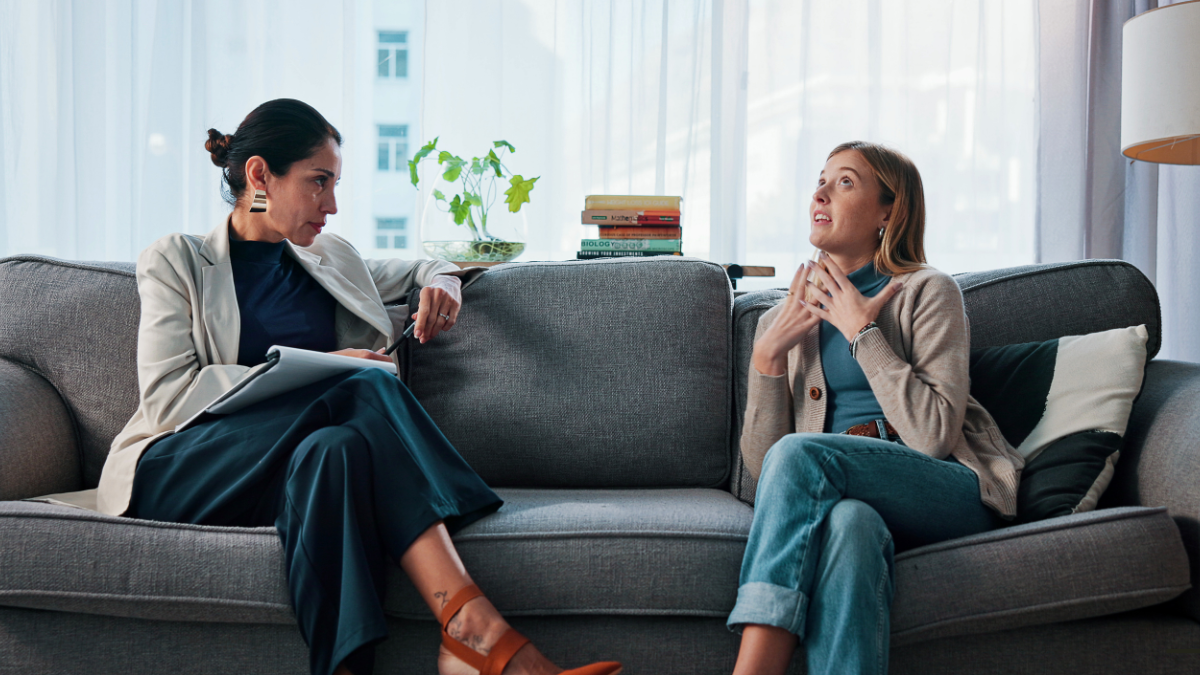 Homepage 5 Therapist talking with a patient on a couch.